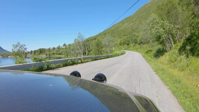 Hood view driving on a Norwegian land road in Northern Norway, Scandinavia, Slow Motion
