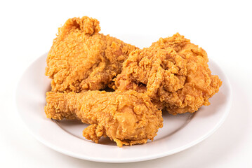 Fried chicken on white plate on white background