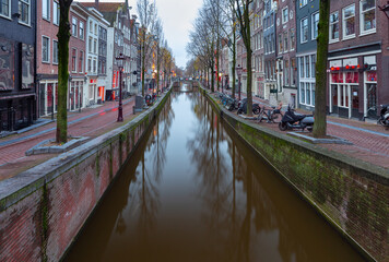 Naklejka premium Amsterdam. Facades of old houses in the red light district.