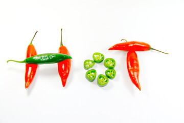 Red-green hot chili peppers. Red-green hot chilli peppers spelling the word "hot" on white background.    