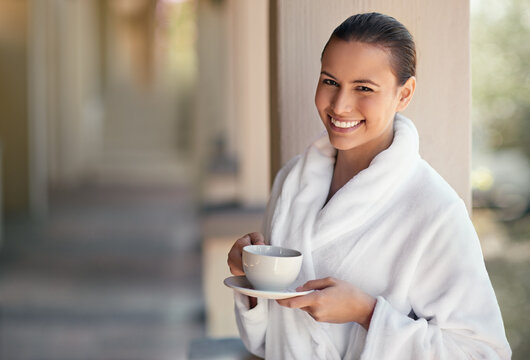 Today its all about me. Shot of a young woman drinking a cup of coffee at the day spa.