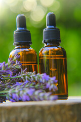 Lavender oil and lavender sprigs .Base cosmetic oil for massage and care for face and body.Organic Lavender Essential Oil Glass Bottles.natural cosmetics.