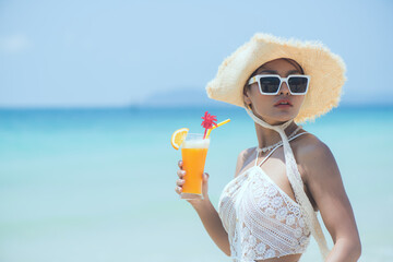 woman with cocktail on the beach. woman with cocktail