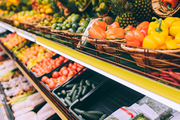Close up, bell pepper. Against the background of fruit vegetables on the shelves in the supermarket.