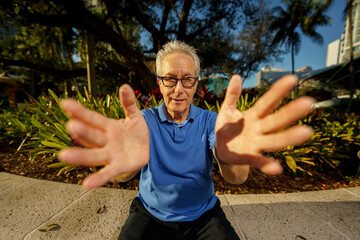 Fisheye angle photo of a man reaching out towards the lens