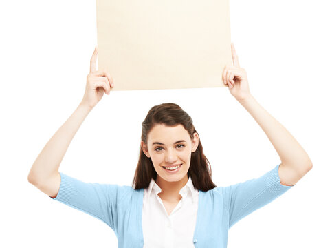 Giving Your Brand A Bright Smile Endorsement. Smiling Young Woman Holding Up A Small Poster Of Copyspace.