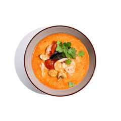 Traditional asian soup - tom yam with prawn and coconut milk isolated on white background. Tom yam kung with seafood and coriander in gray bowl on white background.