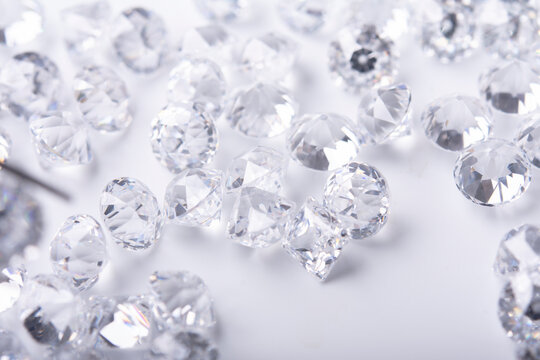 Polished diamonds of different cuts and sizes on light background .Gemstone Beauty