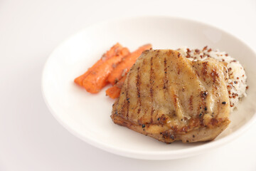 Grilled chicken with rice isolated in white background