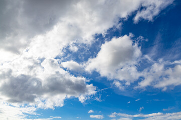 Sunrise on a sunny morning. Veil clouds cover the rising sun. white veil clouds on a blue sky. Climate neutral. 