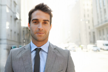 Fototapeta premium The modern businessman. Shot of a well-dressed young businessman in the city.