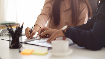 Male boss explaining and having meeting with his assistant