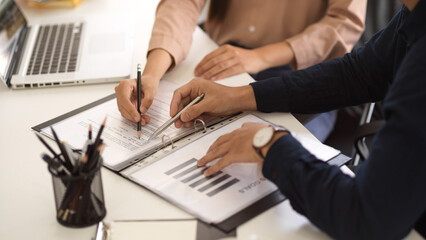 Two financial analysts discuss and plan the business financial