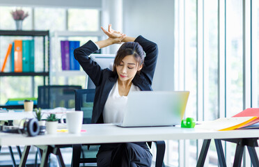 Asian young tired exhausted lazy sleepy female businesswoman secretary employee staff in formal...