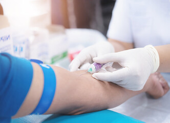 Close up hand of nurse, taking blood sample from a patient in the hospital. - obrazy, fototapety, plakaty