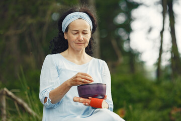 Happy elderly senior woman doing hindu practice