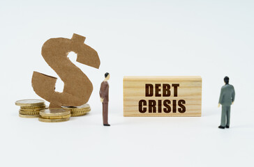 On a white surface, a dollar symbol, a figurine of businessmen and a wooden sign with the...