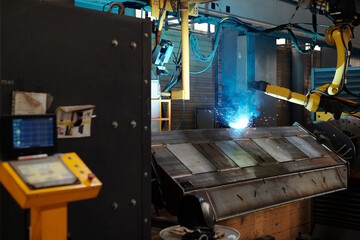Industrial machine and process of arc welding in workshop of contemporary machinery production plant