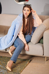 Fototapeta premium female sitting on sofa