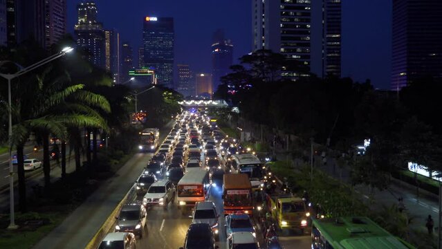 Beautiful busy traffic with highrise buildings at night
