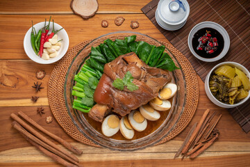 Asian food, Stewed Pork Leg Recipes and egg with five spices  served with blanched kale, black soy sauce, garlic and  fresh chili.