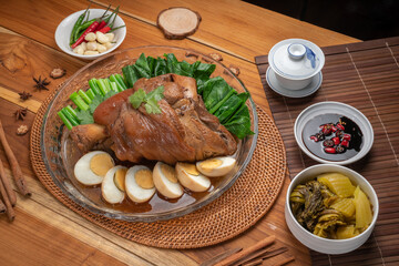 Asian food, Stewed Pork Leg Recipes and egg with five spices  served with blanched kale, black soy sauce, garlic and  fresh chili.