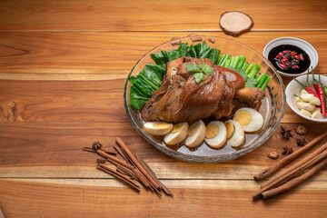 Asian food, Stewed Pork Leg Recipes and egg with five spices  served with blanched kale, black soy sauce, garlic and  fresh chili.