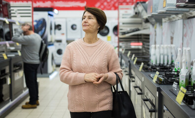 Portrait of a confident European woman who came in an electronics and household appliance shop for...