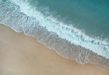 Seascape of the tropical Coast with waves as a background from top view.
