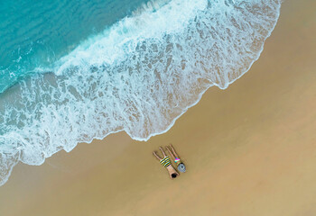 Above view of Relaxation the couple in the holidaywith  sand beaches -Summer  vacation in a holiday concept