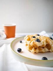 Delicious homemade waffle toping with blueberries