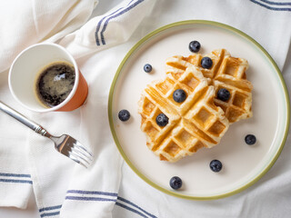 Delicious homemade waffle toping with blueberries