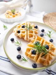 Delicious homemade waffle toping with blueberries