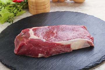 Raw rib-eye beef steak black angus