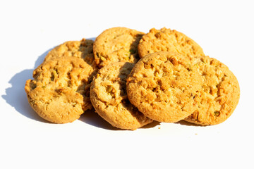Pistachio and almond cookies on white background.
