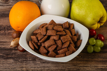 Breakfast with corn chokolate pads and milk