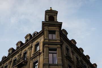Old European building lit by early morning light