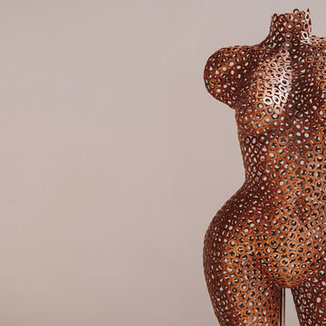 Metal brass, copper woman mannequin. Aesthetic minimal fashion art