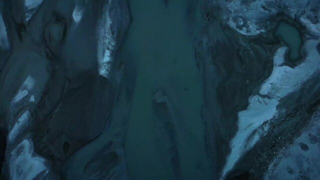 Aerial flyover with pan up revealing Forno glacier in Engadin, Switzerland shortly before sunset. This 6km long glacier is in the Bregaglia area of the Swiss Alps, surrounded by peaks over 3000 meters