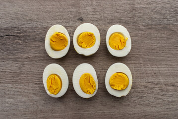Boiled egg on wooden background. Top view.