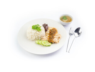Top view of Hainanese chicken rice with hot soup and spicy sauce isolated on white background