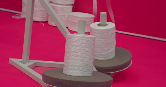 reels from which the plastic rope used for the production of plastic bags is unwound.