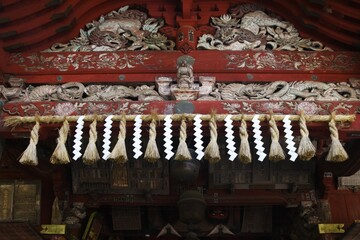 Fototapeta premium The culture and tradition of Japanese shrines Shimenawa. Shimenawa is a sacred rope of ric-straw.It separetes a holy place from other unclean places and is concidered a barrier against evil sprits. 