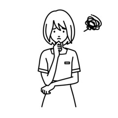 立って手をあごにあてて困っているエステ店員・受付・接客係の女性