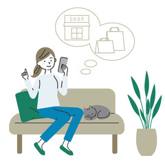 ソファに座ってスマートフォンでネットショッピングを楽しむ女性