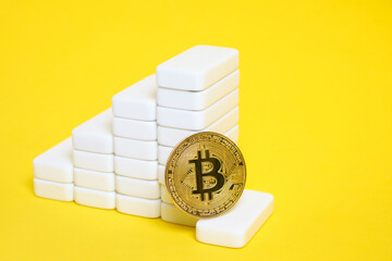 Bitcoin coin is at bottom growing chart.