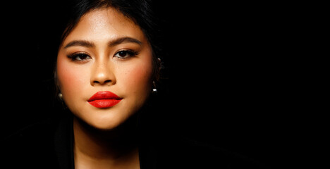 Fototapeta na wymiar Asian 20s Woman chubby wear black fur jacket Red lips and freckles over black dark background