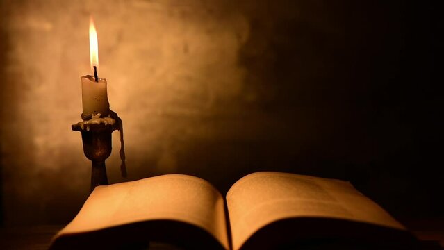 old book with candle