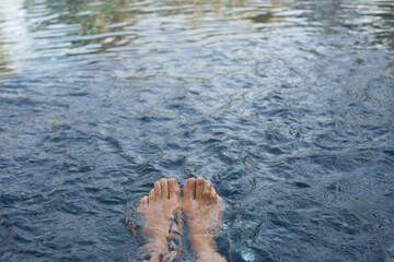 person relax in a swimming pool