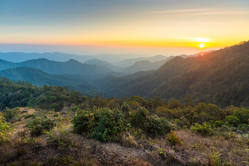 Panorama of Beautiful scenery landscape sunset on mountain peak tropical rainforest. rainforest in the worm summer season at north of Thailand. Jurassic forest walk back to the Jurassic world.